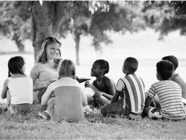 Diverse children learning outdoors